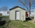 freshly painted shed with new door