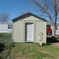 freshly painted shed with new door